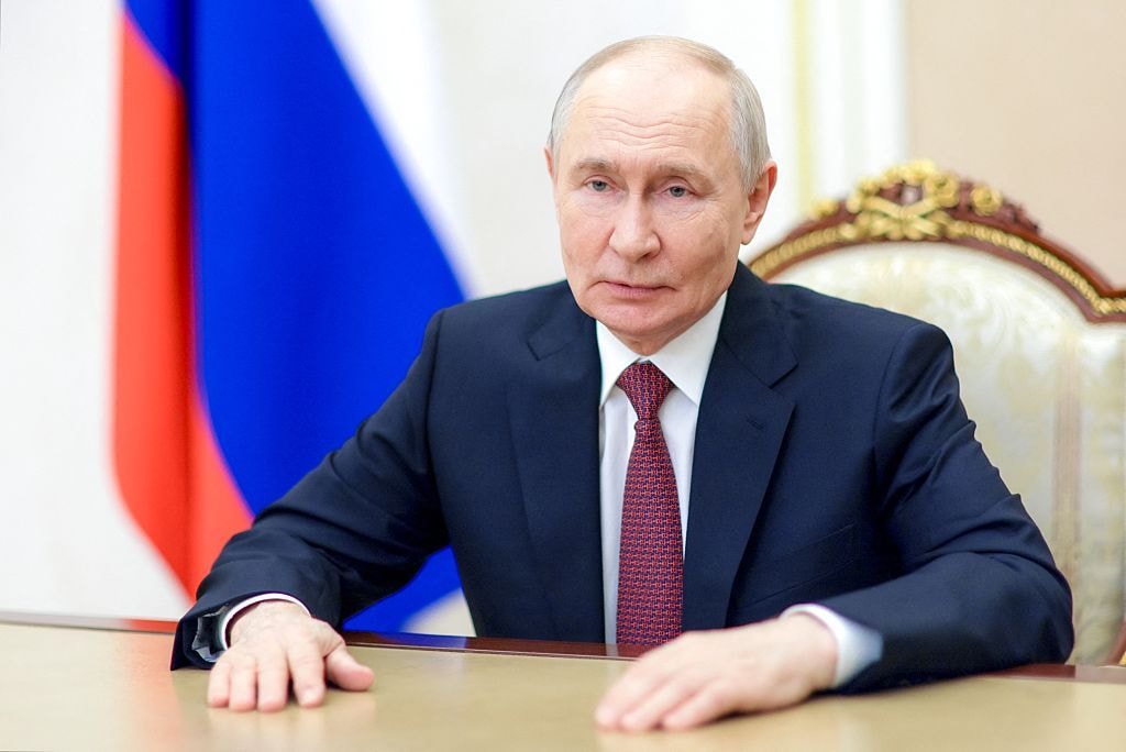 In this pool photograph distributed by the Russian state agency Sputnik, Russian President Vladimir Putin congratulates Russian graduates on finishing school in Moscow on June 26, 2026. (Photo by Gavriil Grigorov / POOL / AFP via Getty Images)