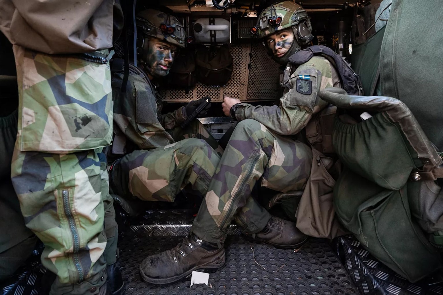 Soldiers with the Swedish Army's South Skåne Regiment load blank ammunition into magazines during Exercise Aurora 26 in Sweden, in May 2026. (NATO)