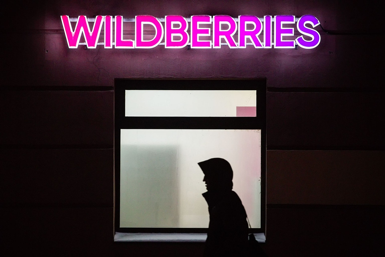 A man walks past one of the Wildberries delivery points in the evening in St. Petersburg, Russia, on Jan. 15, 2024. (Photo by Artem Priakhin/SOPA Images/LightRocket via Getty Images)