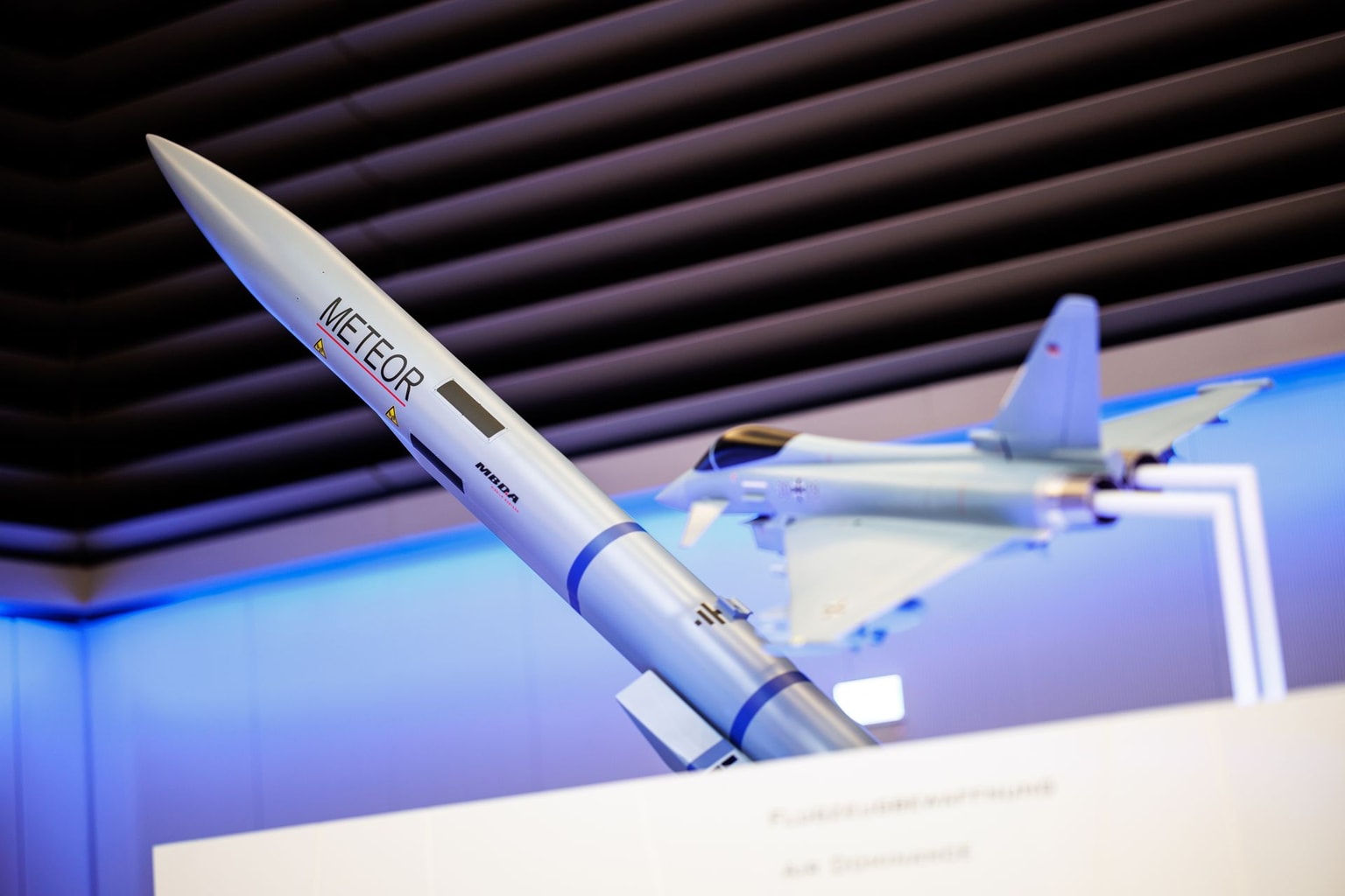 The lettering "MBDA Meteor" is seen on an air-to-air missile next to a model of a fighter jet in a showroom at the European defense company MBDA in Schrobenhausen, Bavaria, Germany, on March 5, 2024. (Matthias Balk / picture alliance / Getty Images)