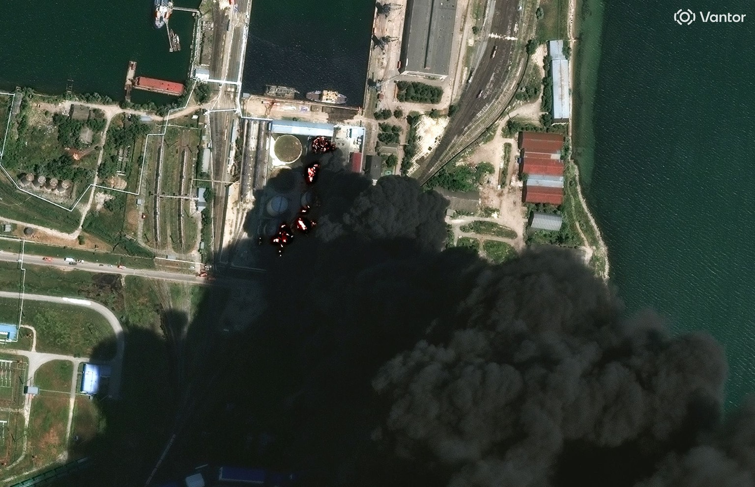 Satellite image shows burning storage tanks and heavy smoke following attacks in Kerch, Crimea, on 20 June 2026 (Vantor via Getty Images)