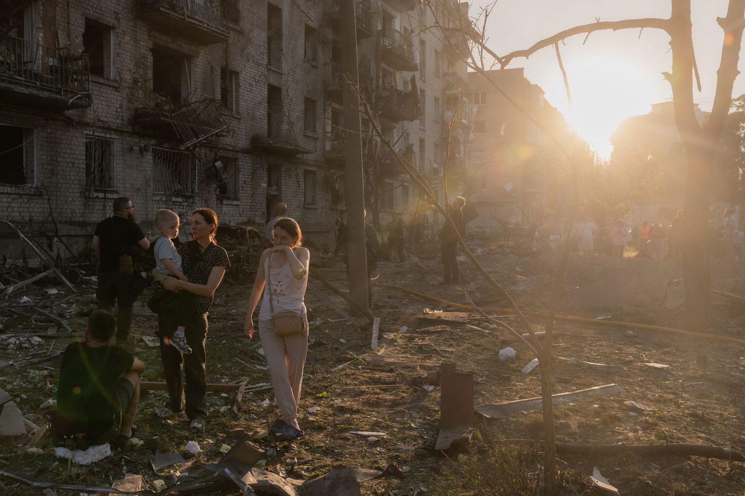 Residents gather at the site of a residential building damaged in a Russian air attack on Kyiv, Ukraine, on July 2, 2026.