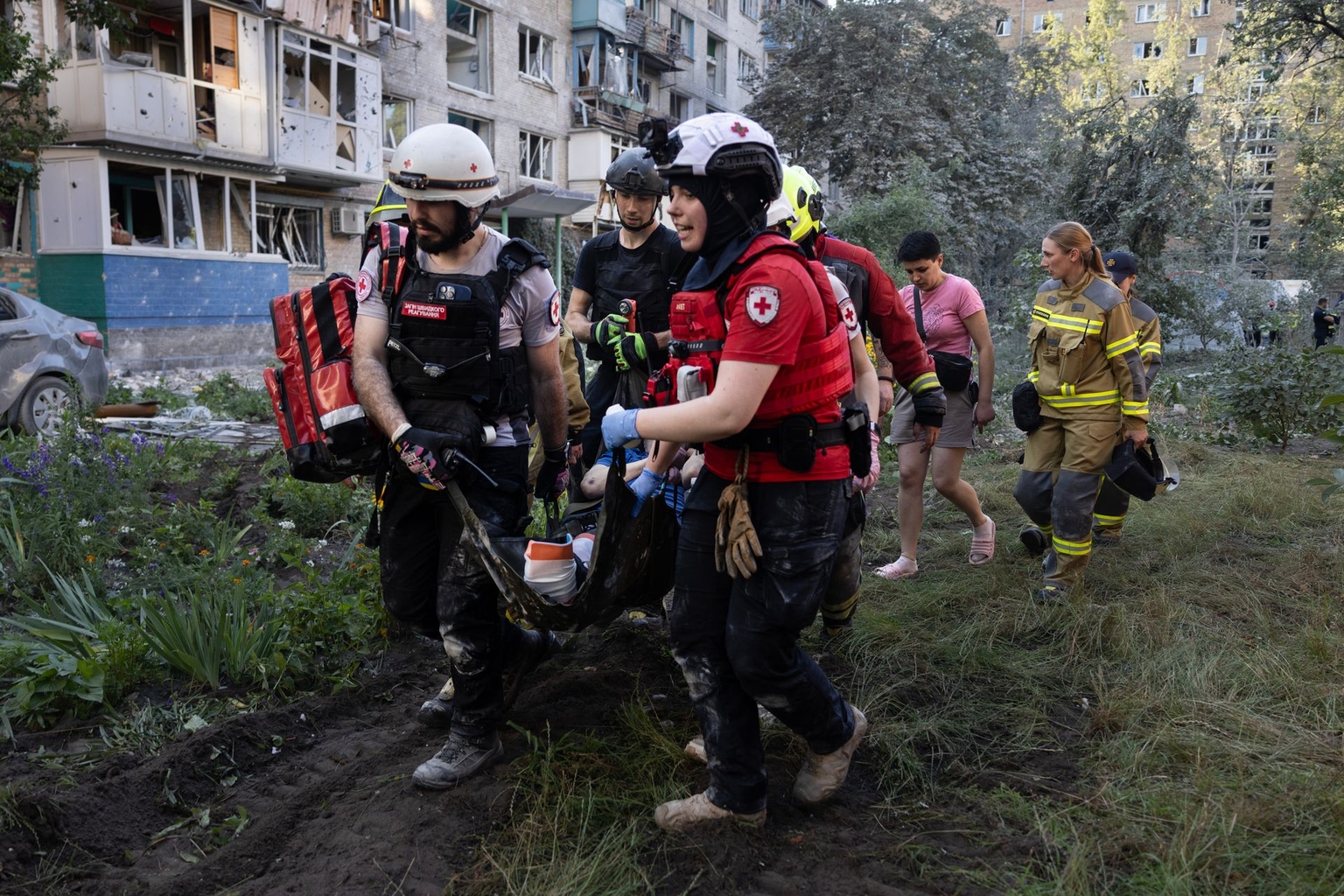 Members of the Ukrainian Red Cross carry an injured resident from a collapsed residential building after a Russian attack in Kyiv, Ukraine, on July 2, 2026.