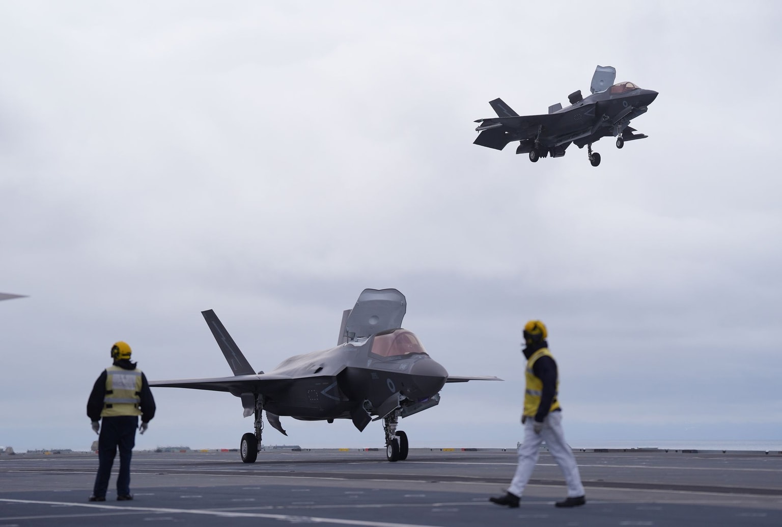 A pair of F-35 B fighter jets land on the deck of HMS Prince of Wales, part of the UK's Carrier Strike Group in the High North, off the coast of Iceland on July 5, 2026. (Yui Mok/PA Images via Getty Images)