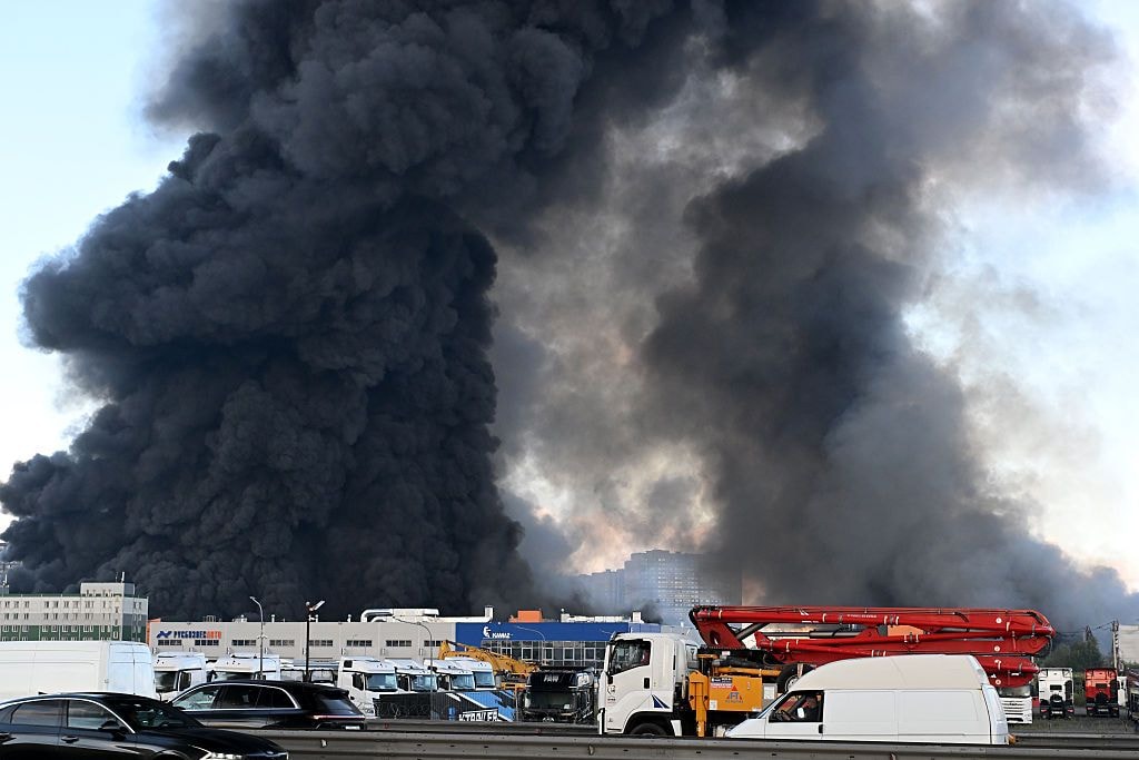 A large plume of smoke rises over St. Petersburg following a Ukrainian drone strike targeting logistics facilities operated by Wildberries, Russia's largest online retailer, on July 24, 2026. (Stringer/Anadolu via Getty Images)