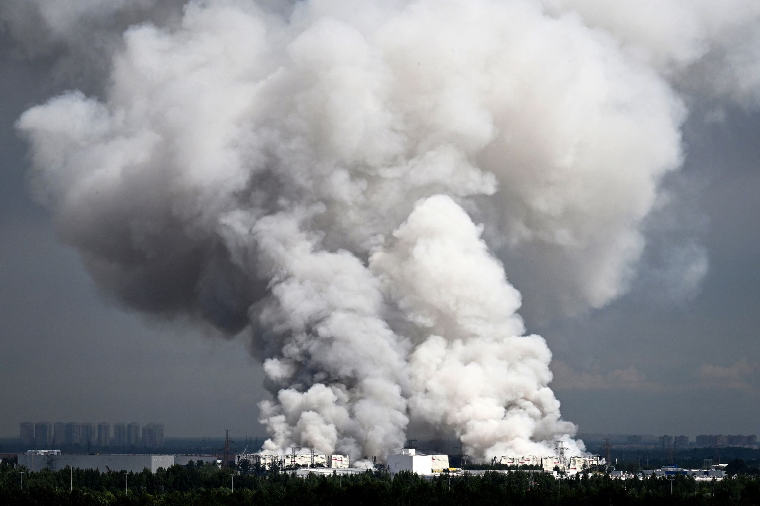 Smoke rises from a warehouse belonging to Russian e-commerce giant Wildberries near St. Petersburg, Russia, after being hit by Ukrainian drones early on July 24, 2026. (AFP / Getty Images)