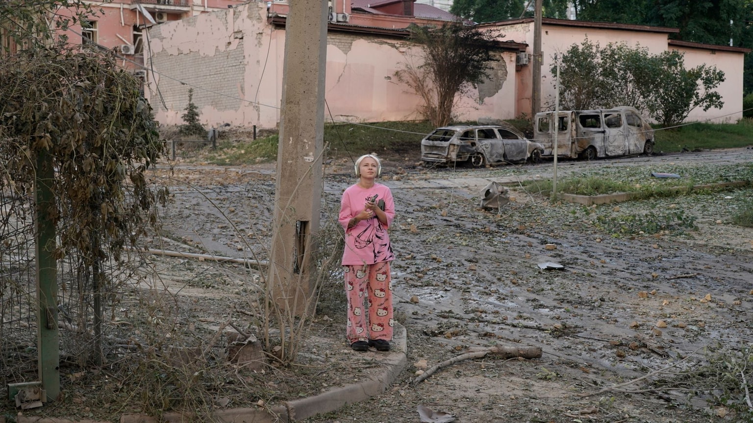 A girl stands amid the damage from a huge Russian ballistic attack on Kyiv overnight on July 19, 2026. (Olena Zashko/The Kyiv Independent)