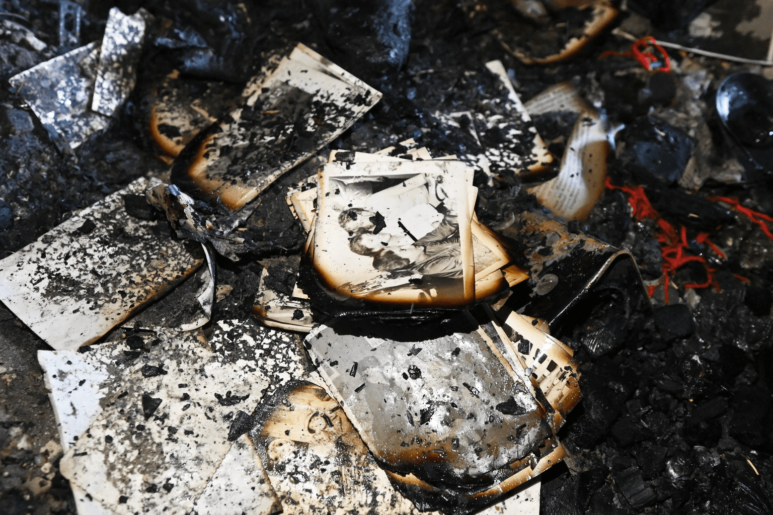 Burnt photos, books remain in an apartment damaged by a Russian strike in Kyiv, Ukraine, on October 10, 2025.
