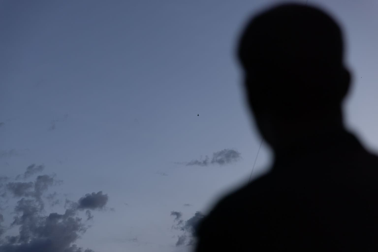 A Ukrainian serviceman watches a P1-Sun interceptor drone fly in Kharkiv Oblast on May 20, 2026.