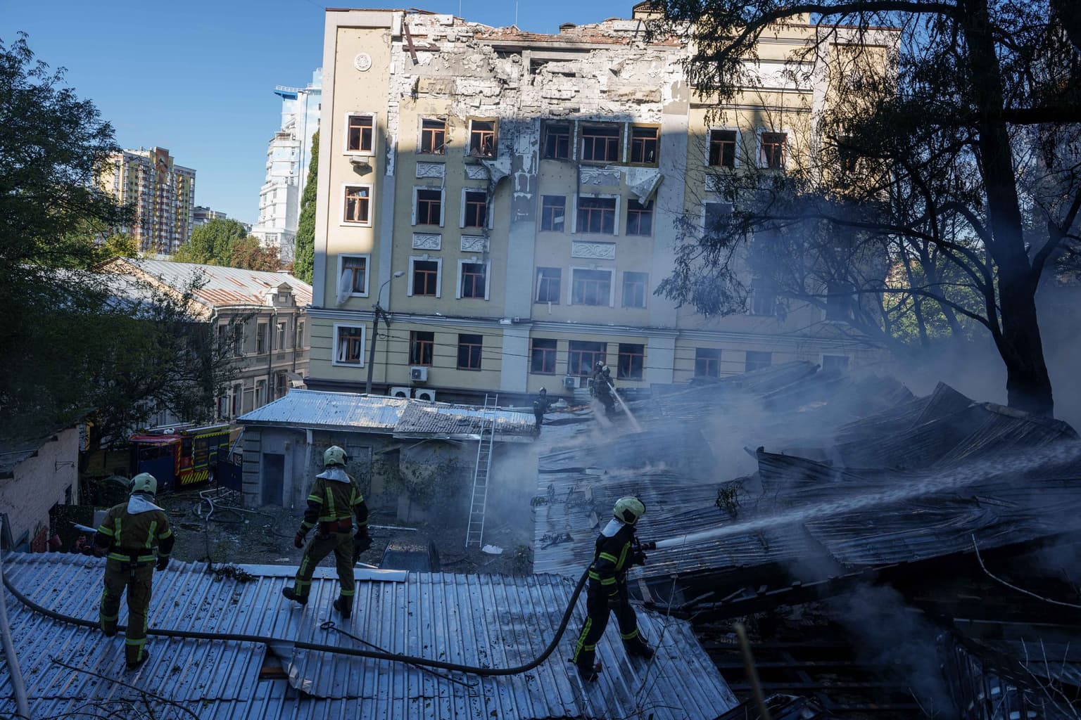 Rescue workers put out a fire at a building damaged in a Russian drone strike in Kyiv, Ukraine, on Sept. 25, 2026.