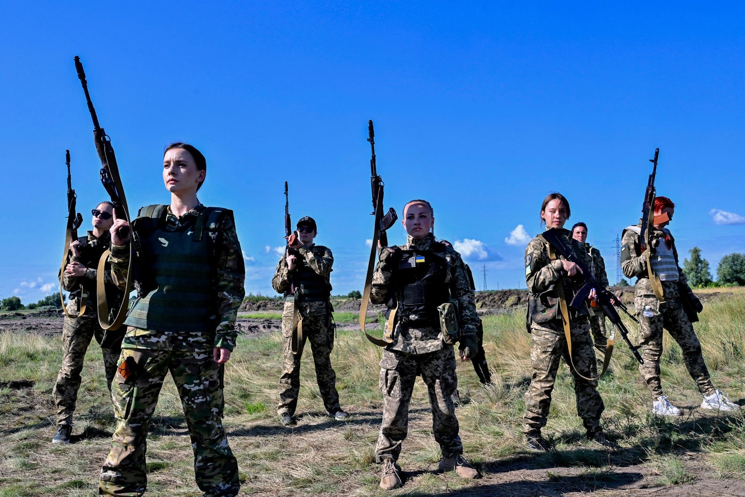 Ukrainian cadets, wearing new military uniforms designed specially for women, attend the "Uniform Matters" event organized to present the outfit and test it under military training conditions, on the outskirts of Kyiv, Ukraine, on July 12, 2023. (Sergei Supinsky / AFP via Getty Images)
