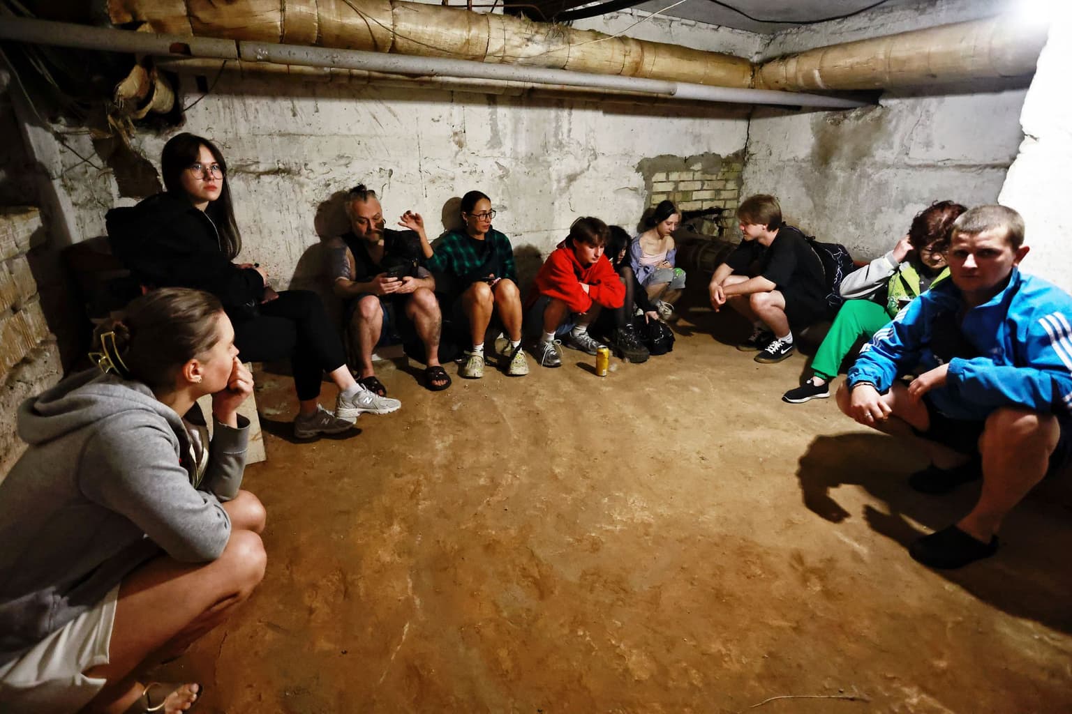 People take shelter during a Russian missile and drone attack in Kyiv, Ukraine, on July 4, 2025.