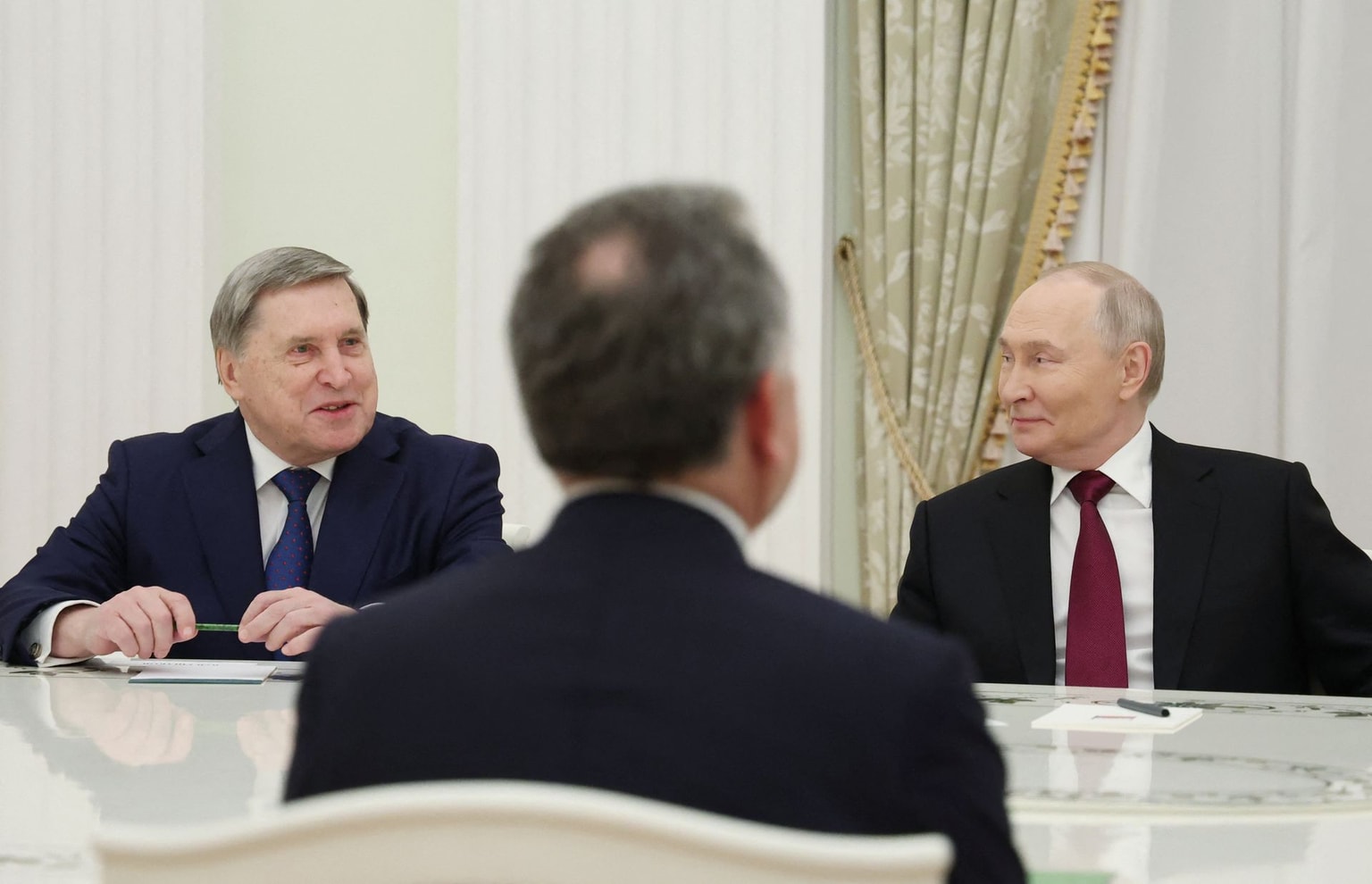 Photo for illustrative purposes. Russia's President Vladimir Putin and Kremlin aide Yuri Ushakov attend a meeting with U.S. special envoy Steve Witkoff at the Kremlin in Moscow on Dec. 2, 2025. (Alexander Kazakov/AFP via Getty Images)