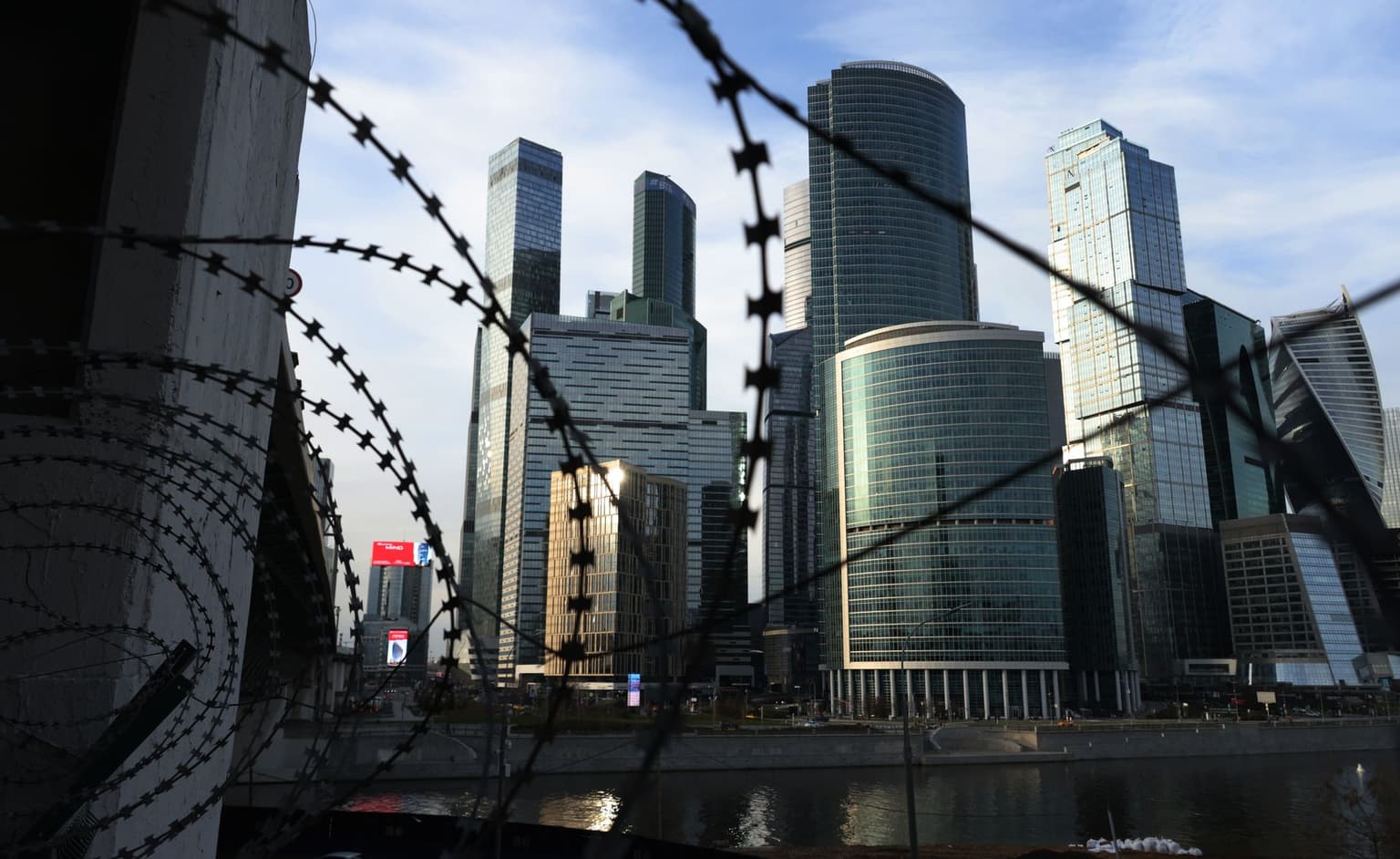 Moscow City skyscrapers are seen through barbed wire in Moscow, Russia, on April 25, 2026.