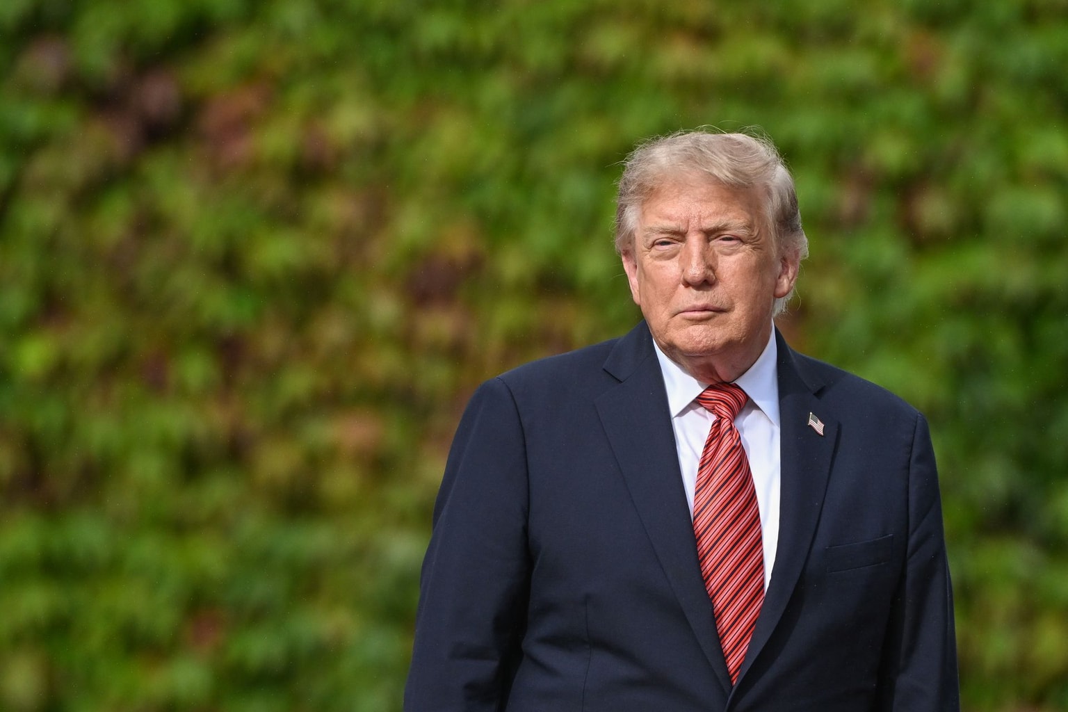 U.S. President Donald Trump pauses to take questions from journalists while walking across the lawns of Aras an Uachtarain to his official vehicle on September 12, 2026, in Dublin, Ireland. (Artur Widak/NurPhoto via Getty Images)