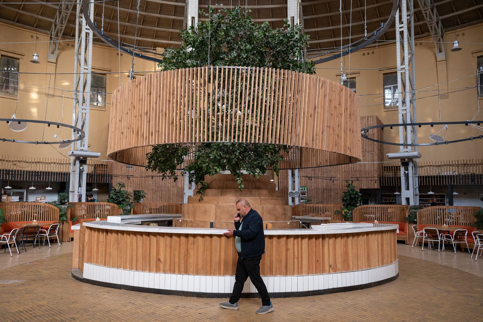 A man walks past a closed bar at the Bessarabskyi Market in Kyiv, Ukraine on Oct. 6, 2026.