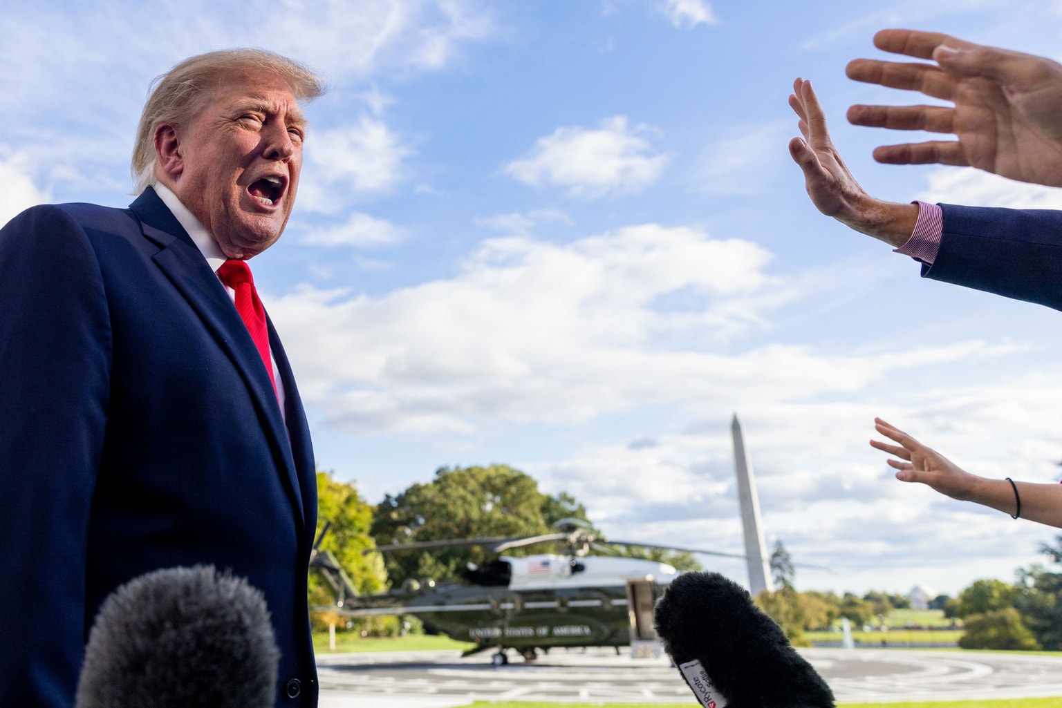 US President Donald Trump speaks to members of the media on the South Lawn of the White House before boarding Marine One in Washington, DC, US, on Oct. 12, 2026. (Shawn Thew/EPA/Bloomberg via Getty Images)